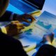 Hands of business executives analyzing company activity
