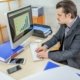 A young businessman working from his office  - the concept of hard work